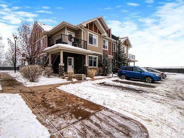 1, 67 West Coach Manor SW Calgary