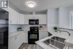 7110, 304 Mackenzie Way SW Airdrie